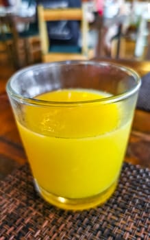 Glass of orange fruit juice food and drink in the restaurant PapaCharly Papa Charly in Playa del Carmen Quintana Roo Mexico.