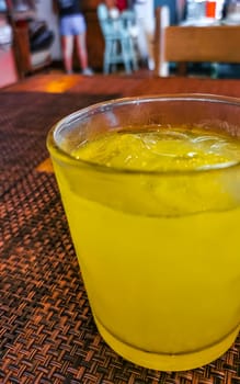 Glass of orange fruit juice food and drink in the restaurant PapaCharly Papa Charly in Playa del Carmen Quintana Roo Mexico.