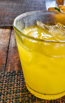 Glass of orange fruit juice food and drink in the restaurant PapaCharly Papa Charly in Playa del Carmen Quintana Roo Mexico.