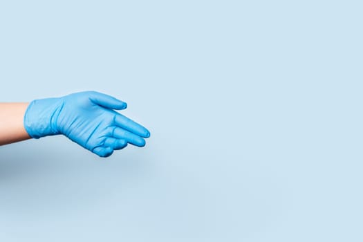 The hand in the blue medical glove is sadly lowered down.