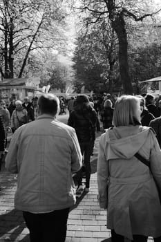 Vertical shot of people walking in Bad Harzburg's pedestrian zone at the Kastanienfest 2022