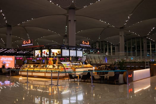 ISTANBUL, TURKEY - August 09, 2022: Modern interior of cafe and bar with snacks and drinks in Istanbul International Airport. Turkey