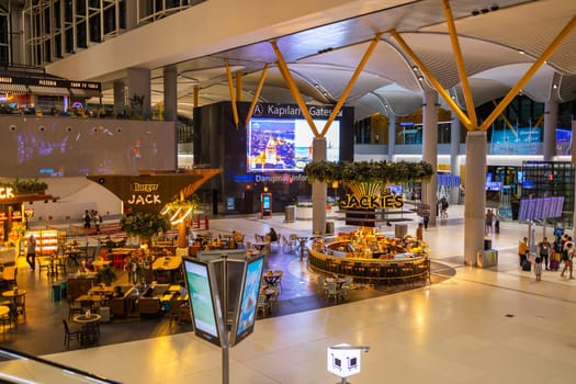 ISTANBUL, TURKEY - August 09, 2022: Modern interior of cafe and bar with snacks and drinks in Istanbul International Airport. Turkey