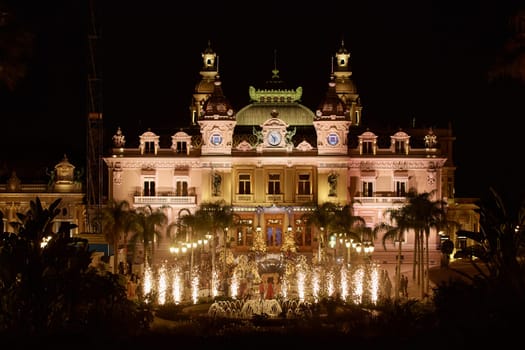 Monaco, Monte-Carlo, 12 November 2022: Festive fireworks at a wedding celebration on the square of the famous Casino Monte-Carlo is at night, attraction night illumination. High quality photo