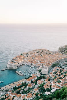 Boats are moored in the ancient port. Dubrovnik, Croatia. High quality photo