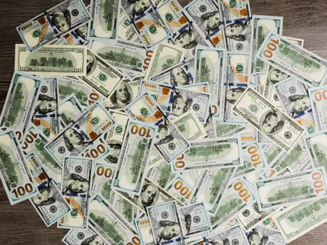 New hundred dollar bills lie on the floor. business growth, finance and investment concept.