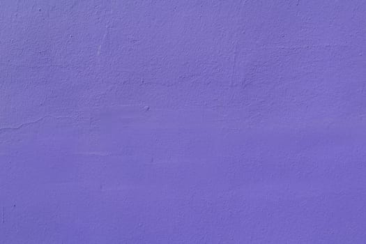 The surface texture of rough green plaster. Abstract background of lilac wall surface.