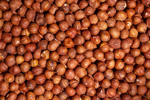 Scattered Peeled Hazelnut - Top View. Background from Hazelnuts. Natural High-Calorie Snacks