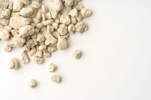 Mineral cat litter filler isolated on white background