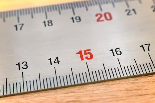 A fragment of metal measuring ruler with centimeter and millimeter divisions.