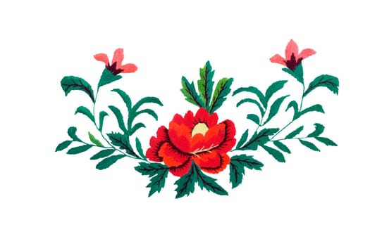 DIY: beautiful red flowers and green leaves embroidered on a white background surface.