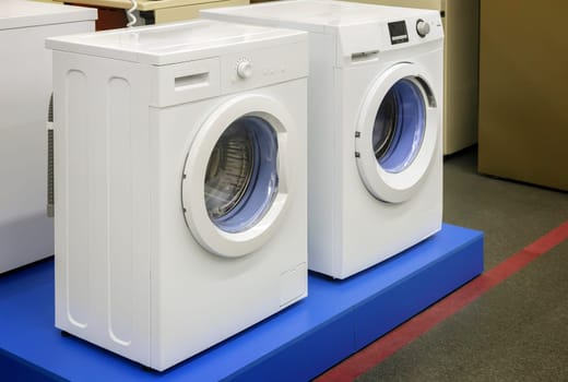 The hardware store is for sale a modern washing machine of different manufacturers and with different type of Laundry load.