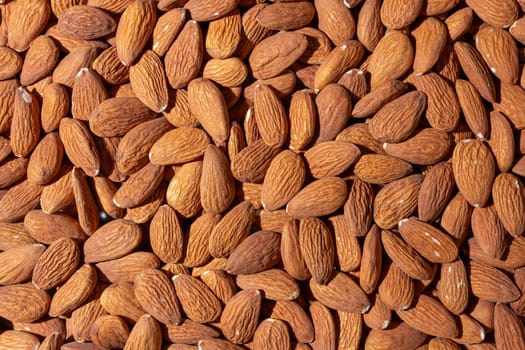 Scattered Almonds. Background from Almond Nuts. Natural High-Calorie Snacks