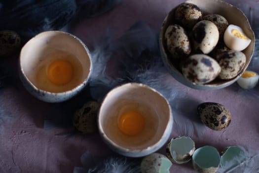 quail eggs in ceramic vases, gray feathers on the table, Easter still life with dietary eggs, diet and antioxidants, dark key and shallow depth of field, high quality photo