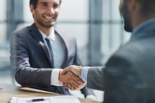 Close up of handshake in the office