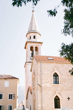 Tall white bell tower of St. Ivan Cathedral. Budva, Montenegro. High quality photo