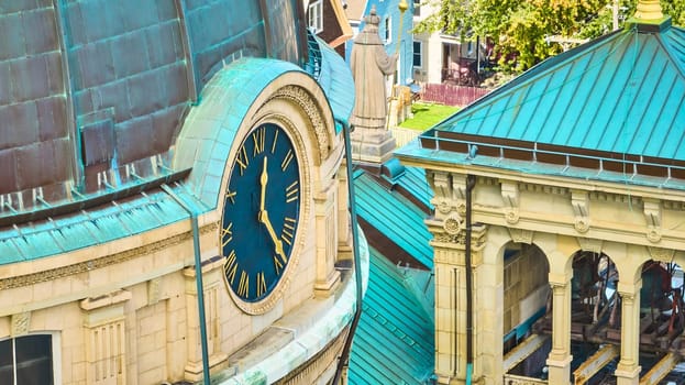 Classical architecture and ornate clock tower of the Basilica of St Josaphat in Milwaukee, Wisconsin, captured in daylight from an elevated perspective