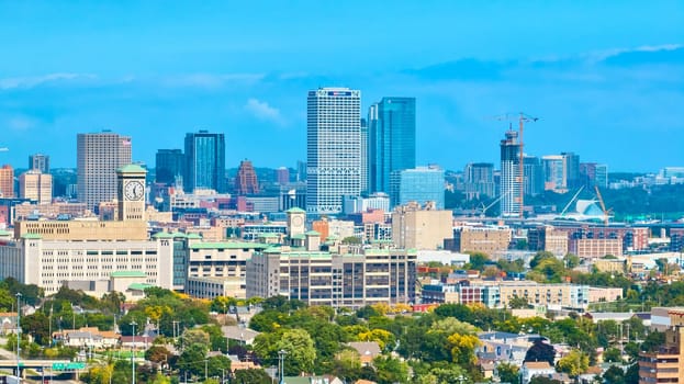 2023 Aerial view of a vibrant Milwaukee cityscape, showcasing a mix of modern and historic architecture, captured by DJI Mavic 3 drone.