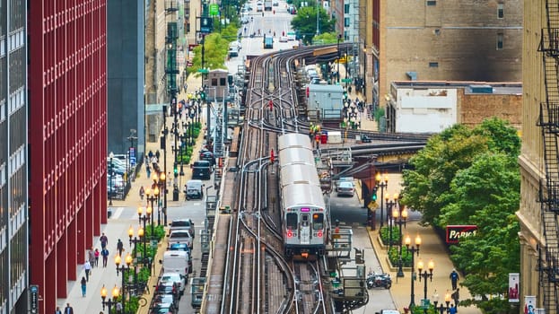 Image of Train on railroad in big, inner city aerial of Chicago tourism transit and travel