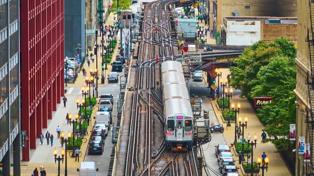 Image of Train on track in big, inner city aerial of Chicago tourism transit and travel, transportation