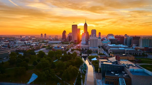 Aerial View of Indianapolis Skyline at Golden Hour - a Mix of Modern and Historical Architecture Reflecting on the River