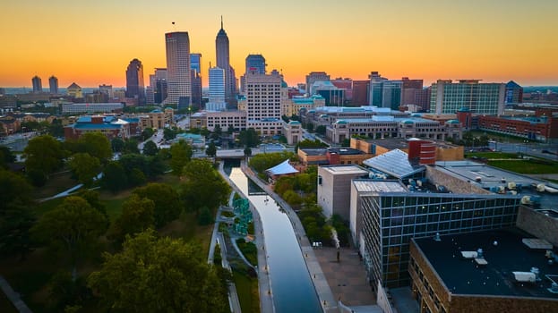 Golden Hour Glow over Indianapolis - Aerial View with River and Modern Skyline, 2023