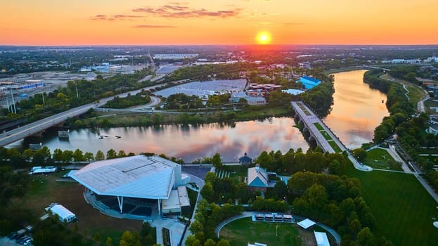 Aerial Sunset View of Urban Indianapolis with Outdoor Amphitheater and Canal, 2023