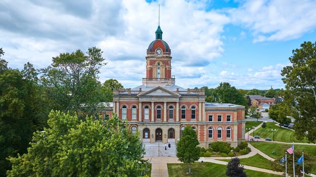 Elevated View of Historic Elkhart County Courthouse in Indiana, Showcasing Classic Architecture and Lush Green Setting, Captured via Drone