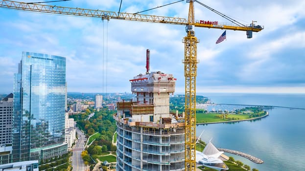 Aerial View of Urban Development, 2023 Milwaukee Skyscraper Construction Site with Northwestern Mutual Building and Coastal Cityscape, Captured via DJI Mavic 3 Drone