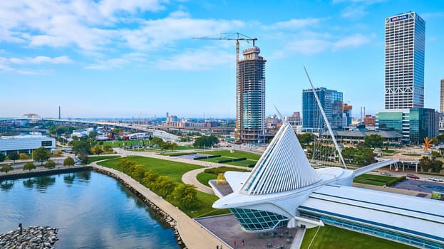 2023 aerial drone view of the modern Quadracci Pavilion in Milwaukee, Wisconsin, showcasing urban development and architectural ingenuity alongside a bustling waterfront.