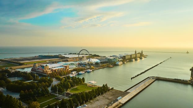 Image of Navy Pier on Lake Michigan at sunrise with aerial of Ferris Wheel at dawn, Chicago, IL