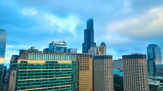 Image of Chicago aerial skyscrapers with pretty blue sky and clouds over downtown buildings, tourism