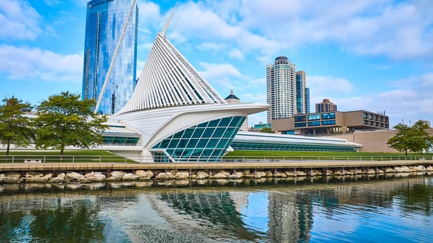 2023 Aerial View of Quadracci Pavilion, Art Museum with Distinctive Wing-Like Structure, Reflecting on Lake Michigan, Amidst Milwaukee's Diverse Urban Landscape