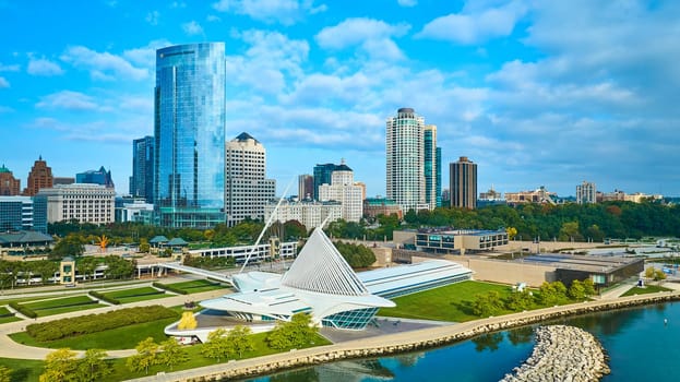 Aerial View of Milwaukee's Modern Cityscape with Iconic Quadracci Pavilion, Lake Michigan in Foreground