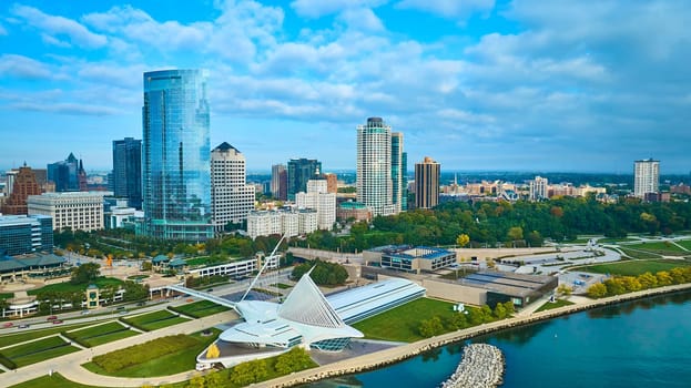 2023 aerial view of Milwaukee's dynamic skyline with modern Quadracci Pavilion and Lake Michigan, showcasing urban growth and sustainable city design