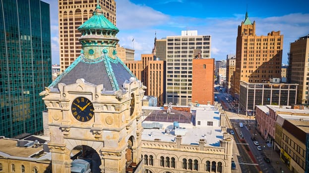 Aerial View of Historic Clock Tower and Modern Skyscraper in Downtown Milwaukee, Showcasing Architectural Contrast and Urban Evolution