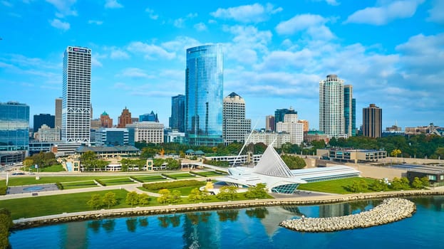 Aerial view of Milwaukee's modern cityscape featuring the Quadracci Pavilion, Lake Michigan, and dynamic skyscrapers, captured by a DJI Mavic 3 drone in 2023