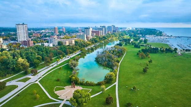 Aerial View of Milwaukee Urban Park, Lake Michigan, and Cityscape at Dusk