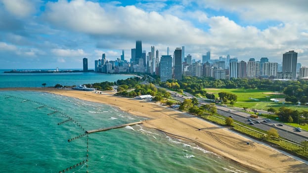 Image of Big city tourism with travel beside sandy coast on summer day, Lake Michigan and Chicago aerial