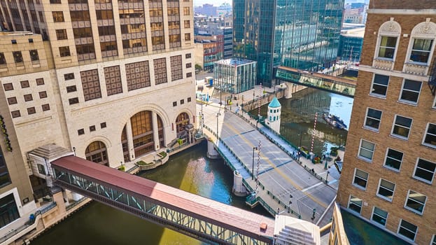 Bustling Milwaukee Cityscape: Aerial View of Iconic Bridge, Architectural Diversity, and Canal Activity