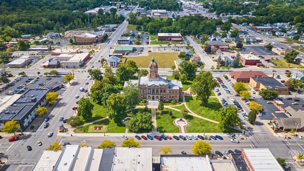 Aerial view of the historic Elkhart County Courthouse in downtown Goshen, Indiana, showcasing small-town charm and community spirit