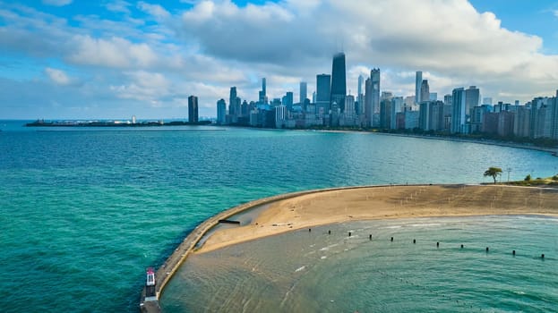 Image of Blue sky over downtown Chicago on summer day with sandy beach along tourism coast, aerial