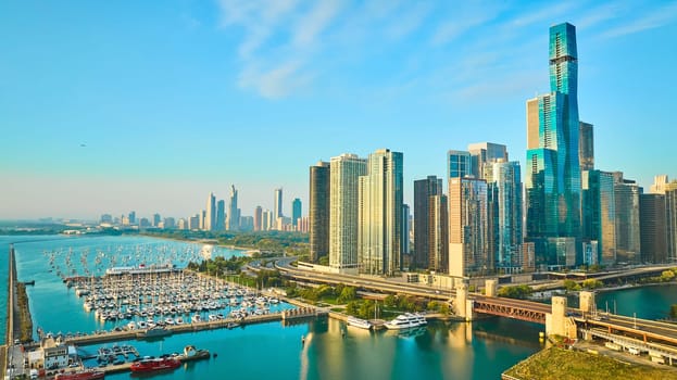 Image of Navy Pier boats and bridge aerial Chicago skyscrapers at sunrise with Lake Michigan coast