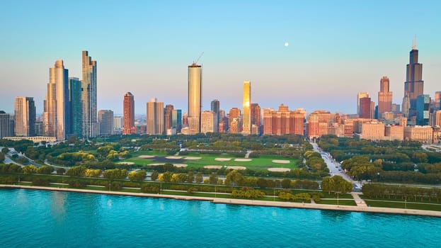 Image of Skyline view of Chicago coastline with Lake Michigan aerial and skyscrapers at sunrise