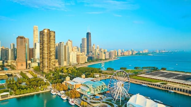 Image of Aerial Chicago skyscrapers along coastline Lake Michigan at dawn with Navy Pier in summer