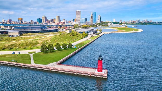 Aerial view of Milwaukee Pierhead Lighthouse and vibrant coastal cityscape, highlighting urban growth and leisurely charm, Wisconsin 2023