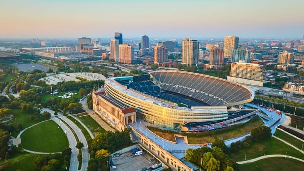 Image of Aerial Soldier Field Chicago football sports stadium at sunrise, Illinois in summer