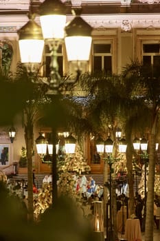 Monaco, Monte-Carlo, 12 November 2022: The Indian wedding celebration in the square of the famous Casino Monte-Carlo is at night, attraction night illumination. High quality photo