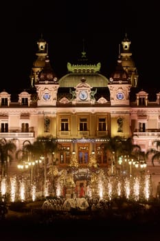 Monaco, Monte-Carlo, 12 November 2022: Festive fireworks at a wedding celebration on the square of the famous Casino Monte-Carlo is at night, attraction night illumination. High quality photo
