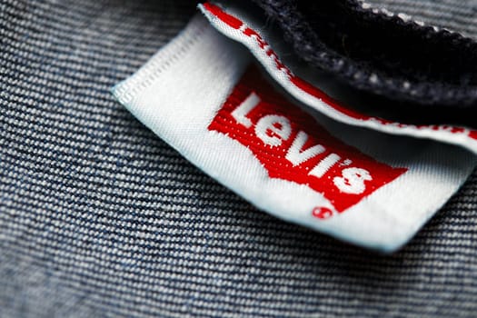 Close up of the of the label of new LEVI'S 501 Jeans on the inside. Logo and stamp LEVI'S on the underside of the textile. Classic jeans model Levi Strauss. 31.12.2021, Rostov, Russia.